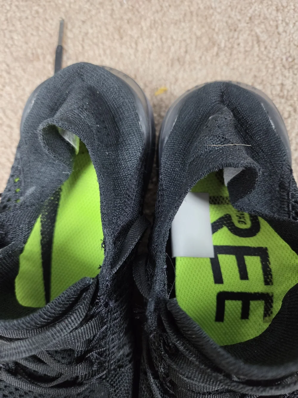 Nike Men's Black Knit Running Shoes with Green Accents